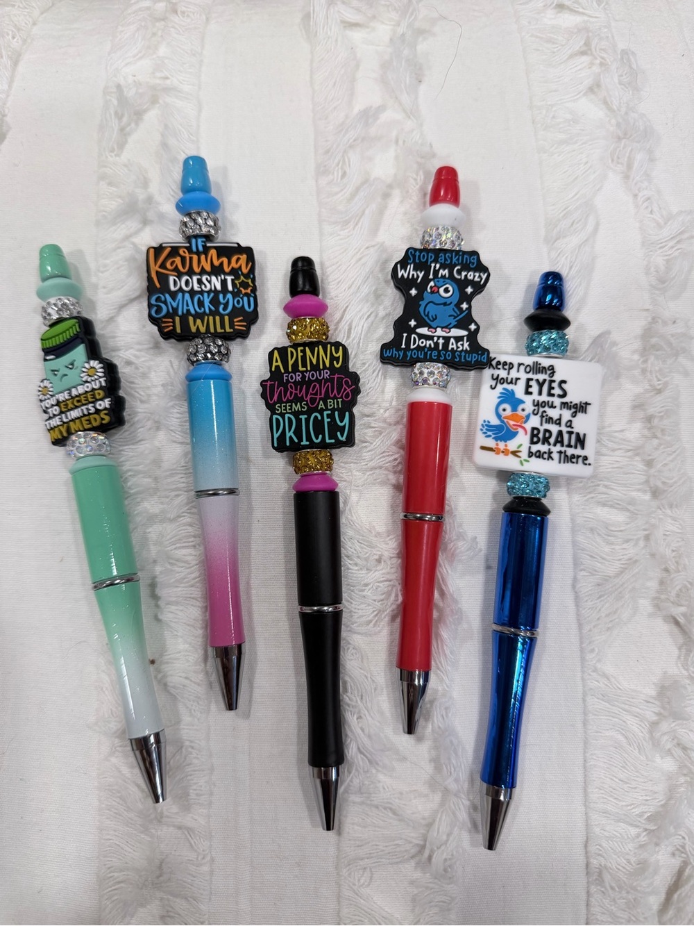 Sarcastic beaded pens with funny sayings.